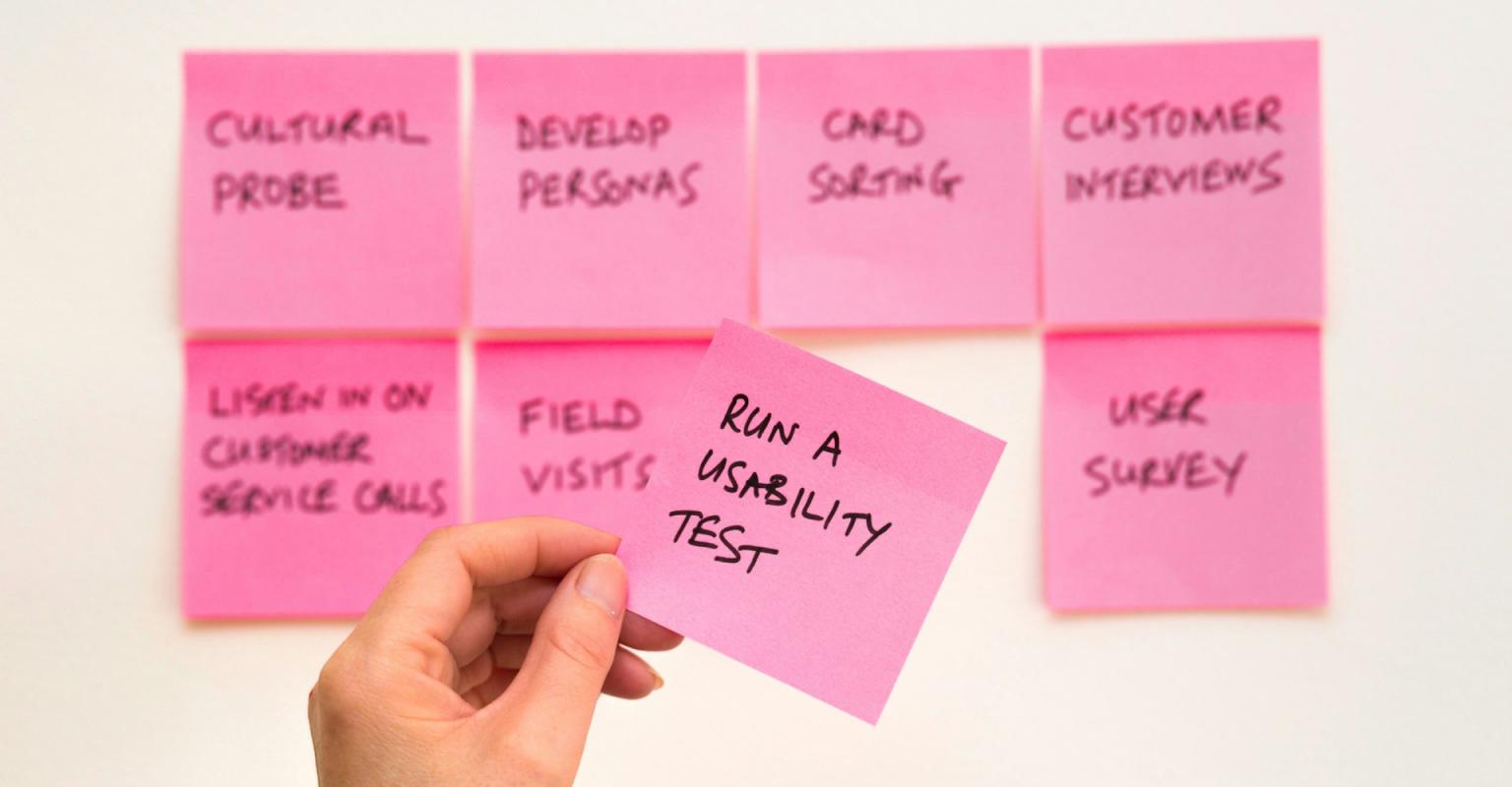pink sticky notes with a focus on usability testing